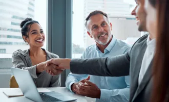 people handshaking at business meeting