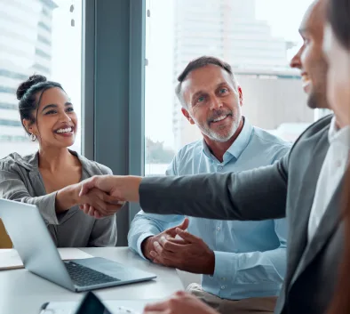 people handshaking at business meeting